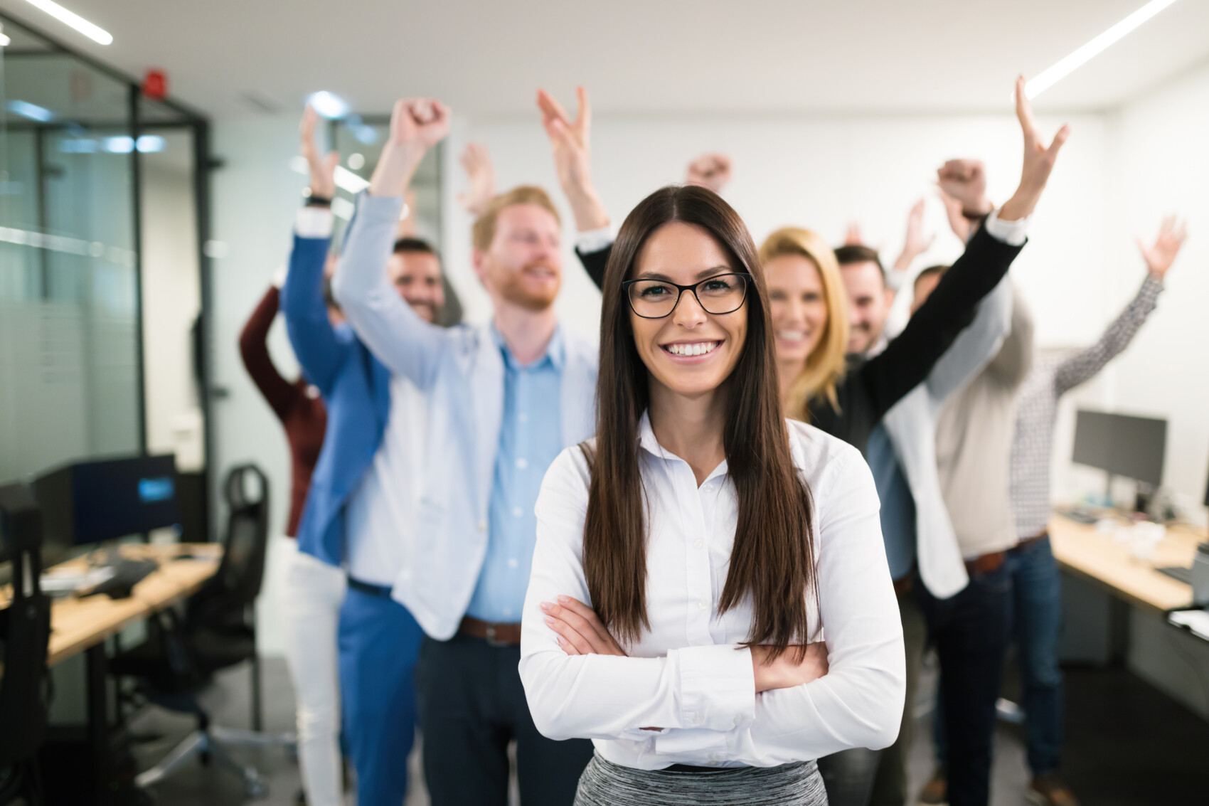 Group of happy and successful business people enjoying work