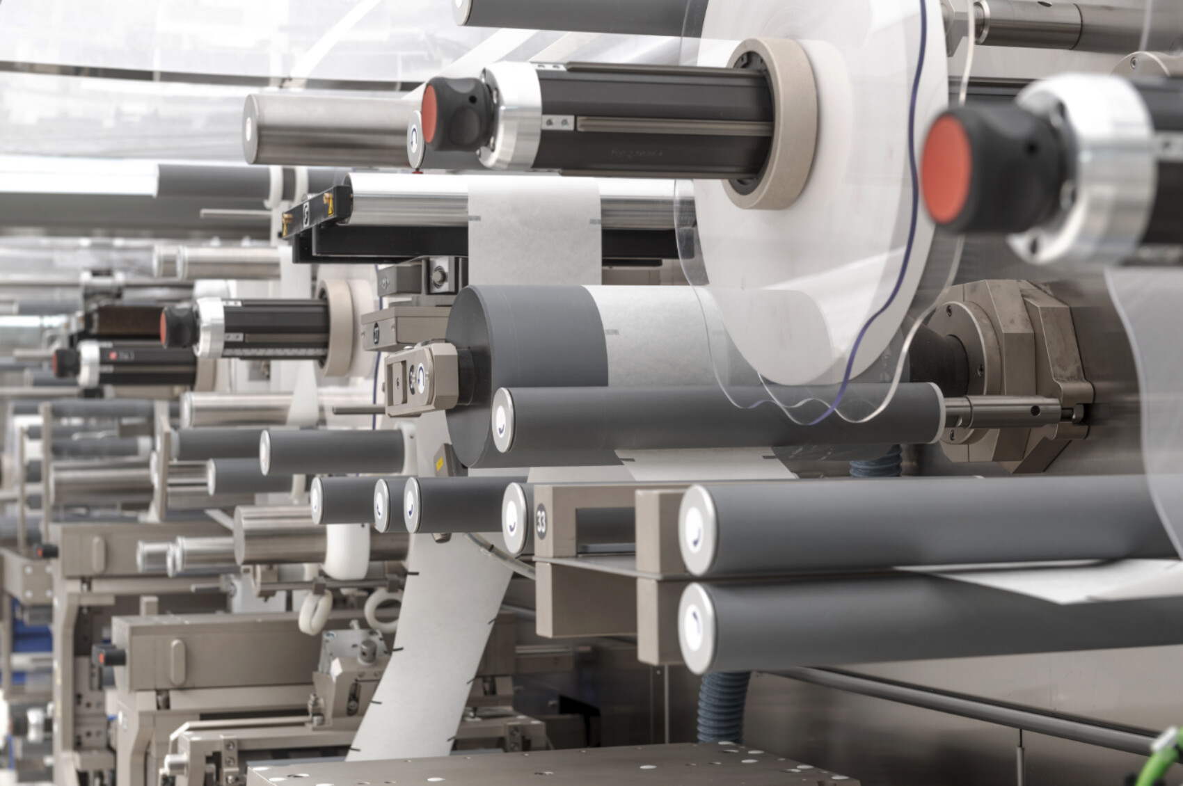 Part of Converting machine showing unwinds, rewinds, idle rollers, pull rollers, web guiding