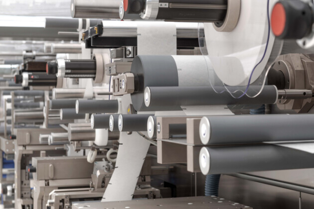 Web Converting Machine including unwinds, rewinds, idle rollers, load cells for tension control, and pull rolls